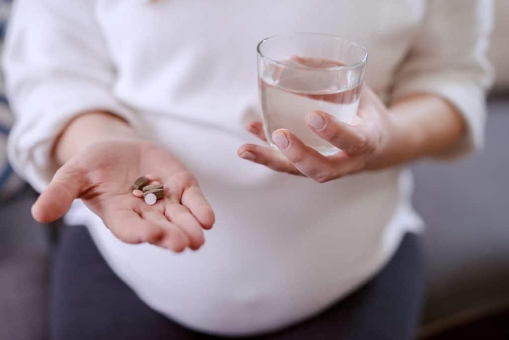 fertility supplements in hand